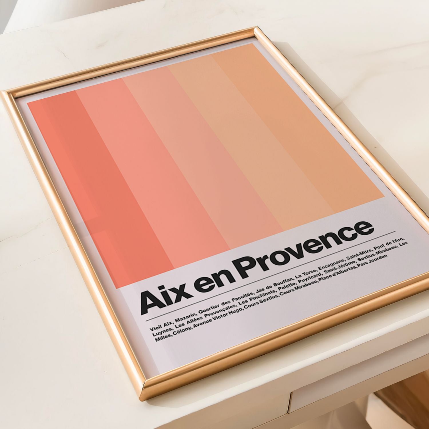 Framed poster with 'Aix en Provence' text and gradient design on a light surface.